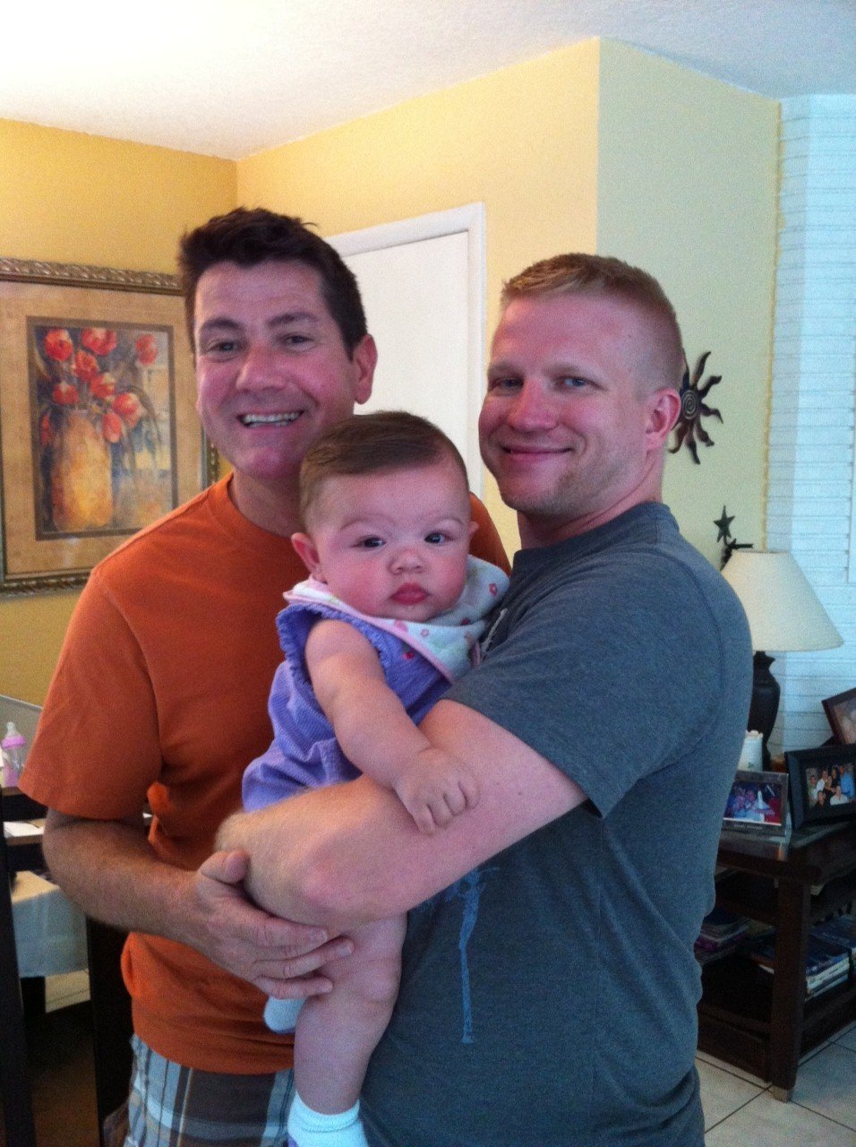 Red polo family trio – every child deserves to feel this safe.